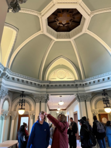 A group of visitors stand in the Hagenah Rotunda.