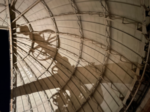 The reflection of the Great Refractor Telescope on the dome's interior.