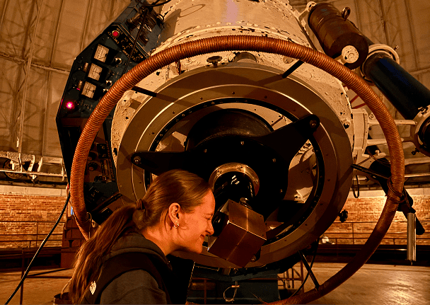 Person looking through the Yerkes telescope eyepiece